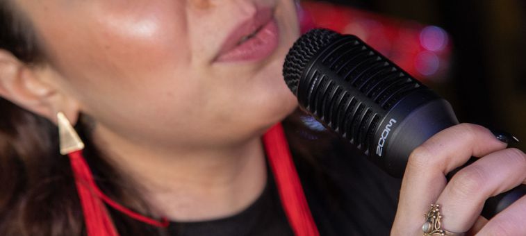 Close up of person singing into microphone