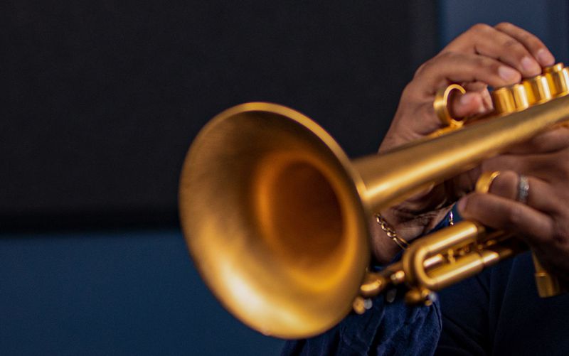 Person inspecting saxophone