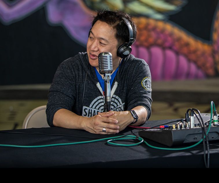 Ming Chen taking to his co-podcaster