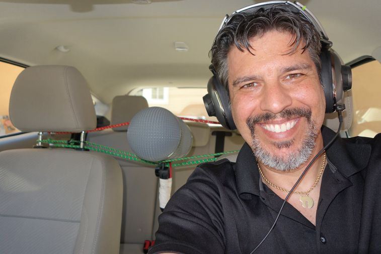 Mark Lanza in the car with his equipment