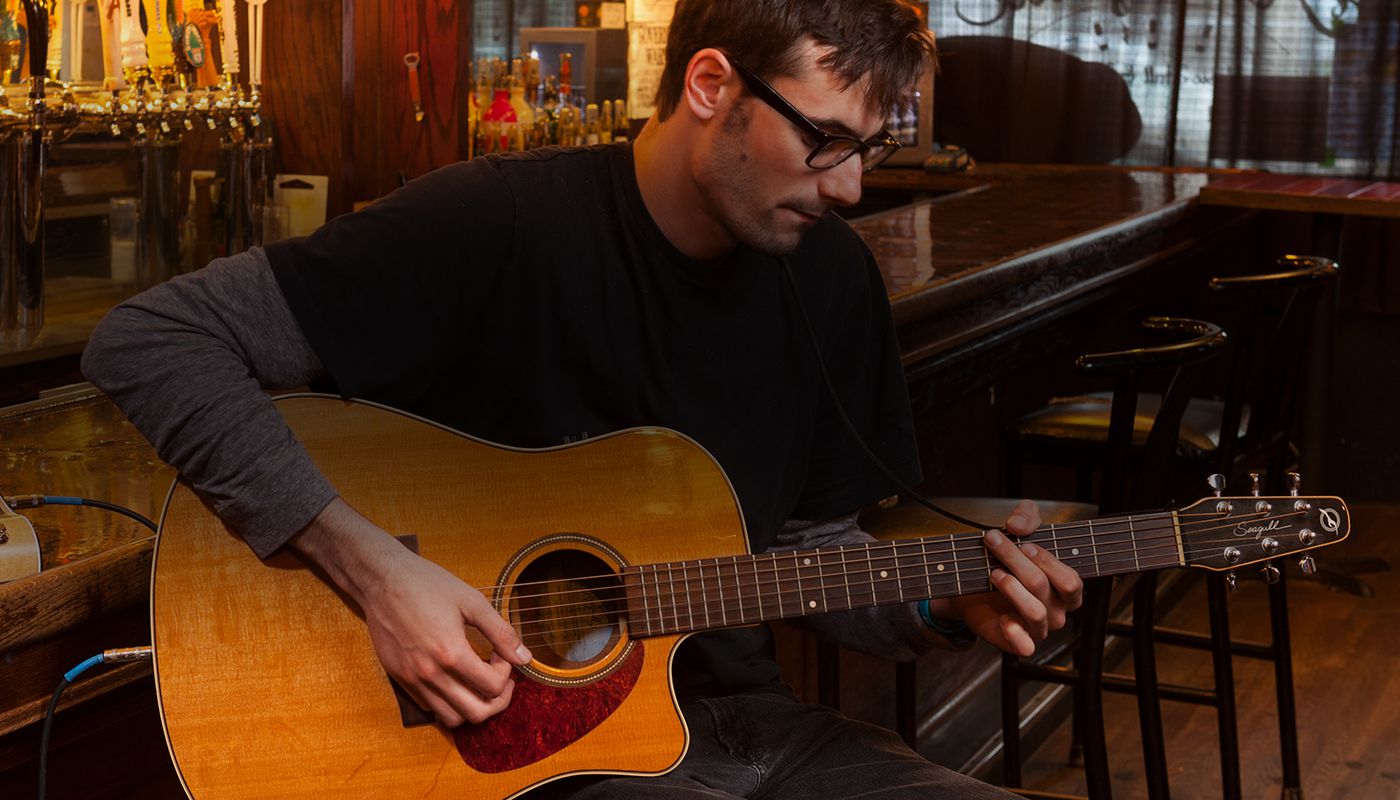 Guitar player at club with AC-3 pedal