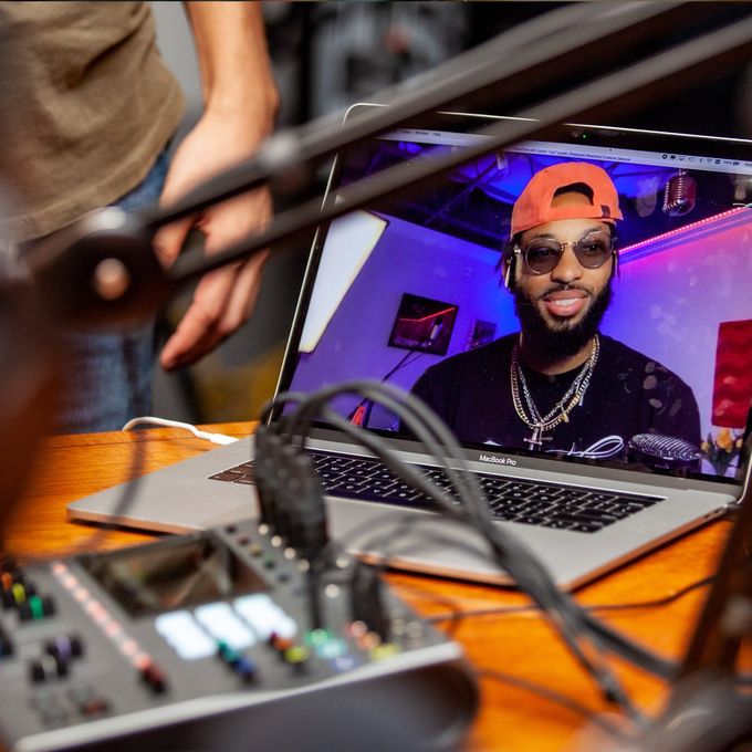 Justin Lyons calling into the Podcast from a laptop