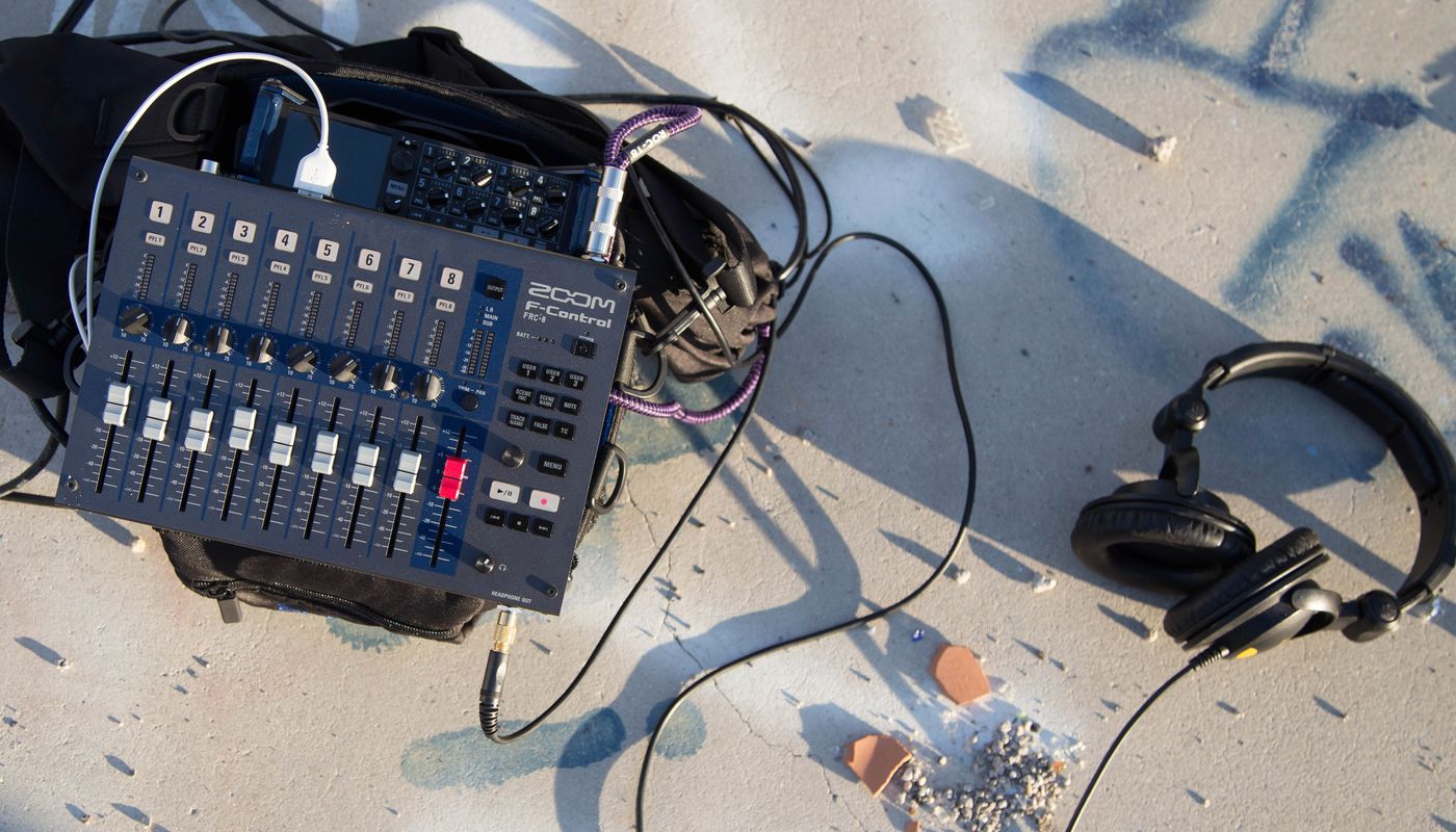 F-Control with headphones connected on the ground in the desert