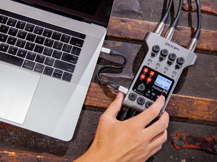 The PodTrak P4 connected to a laptop via USB for interface mode