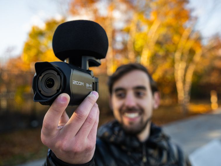 Videographer holding the Zoom Q8n-4K Handy Video Recorder