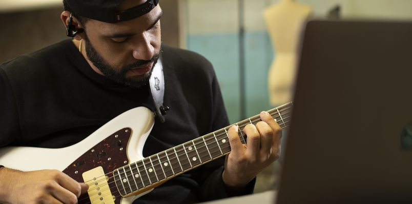 Ricardo Ramos playing a pearly white Fender Jaguar