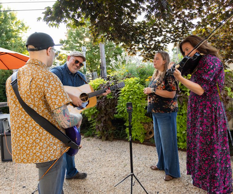 A musical ensemble recording a performance with the H2essential