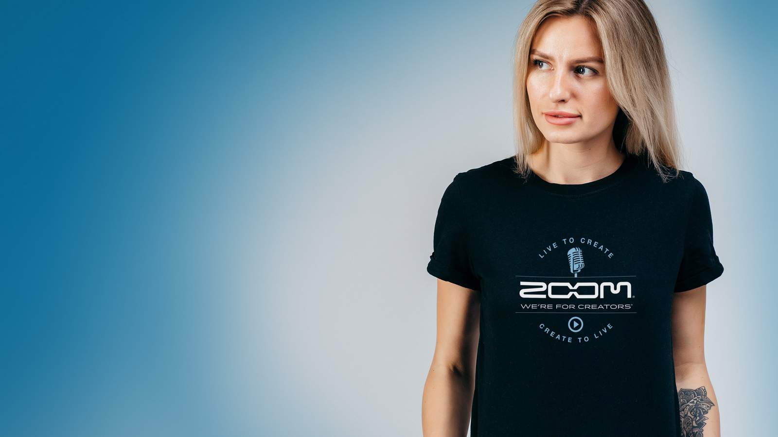 Young woman wearing the Zoom Live To Create t-shirt