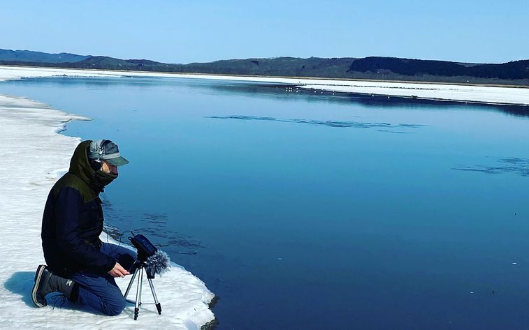 Nick Luscombe recording the sound of water in a cold location