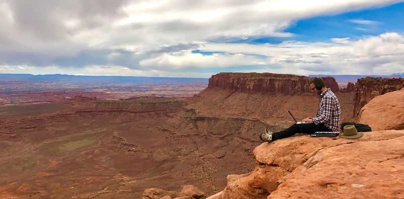 Ross Lara capturing audio in a canyon
