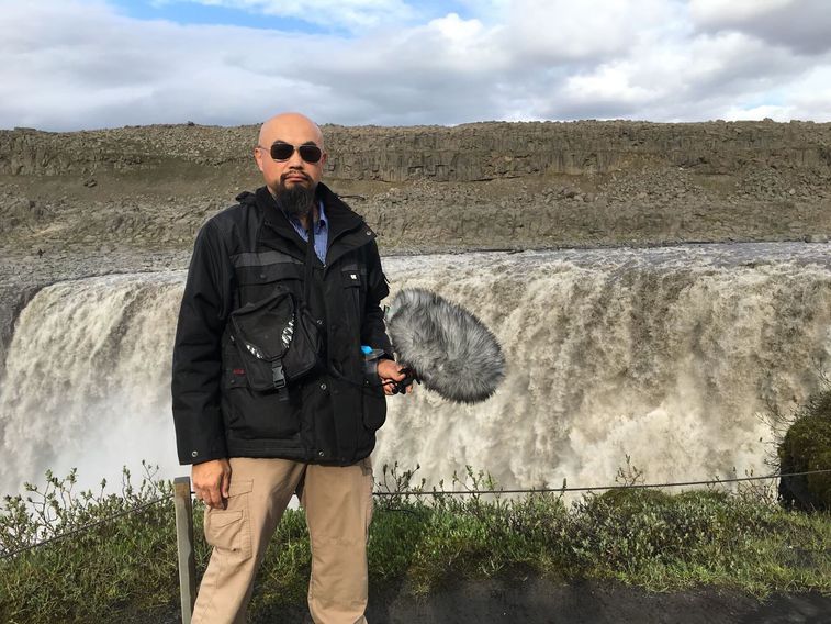 Watson Wu recording audio from a waterfall