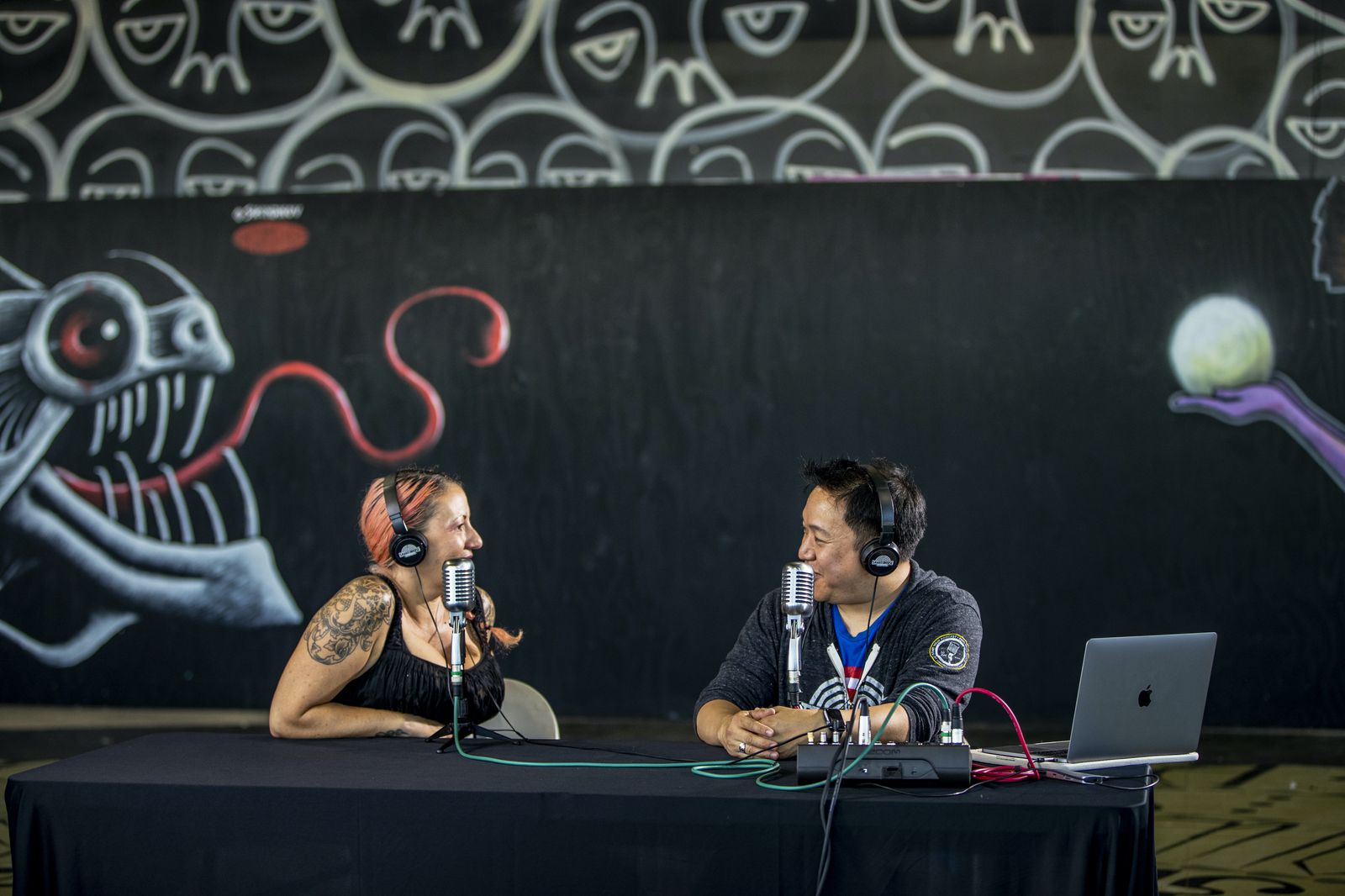 Ming Chen actively engaged in a conversation during his podcast