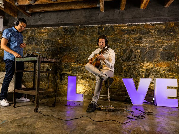 Luisito recording the guitar track by Roman Lajara