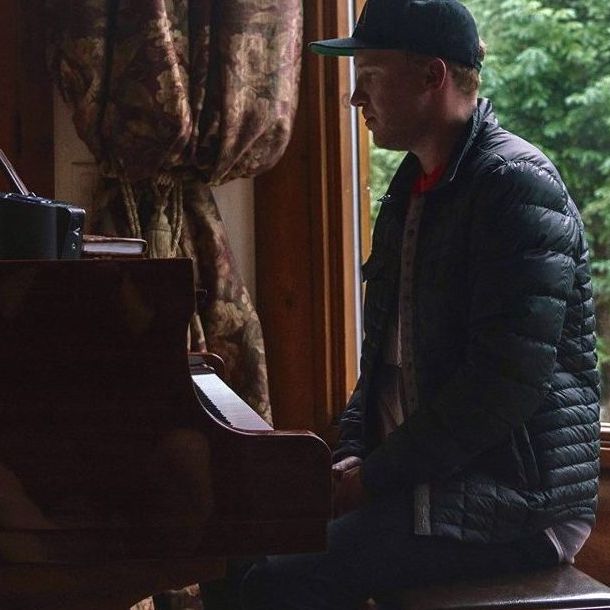 Ross Lara composing at the piano.