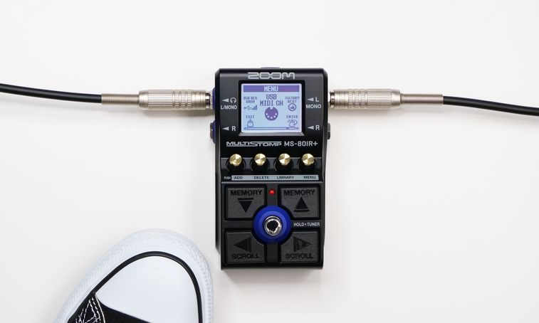 MS-80IR+ at the feet of a guitarist wearing sneakers.