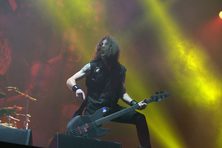 Frank Bello playing bass live on stage