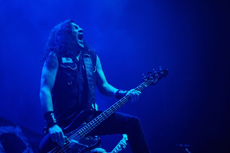 Frank Bello playing bass live on stage