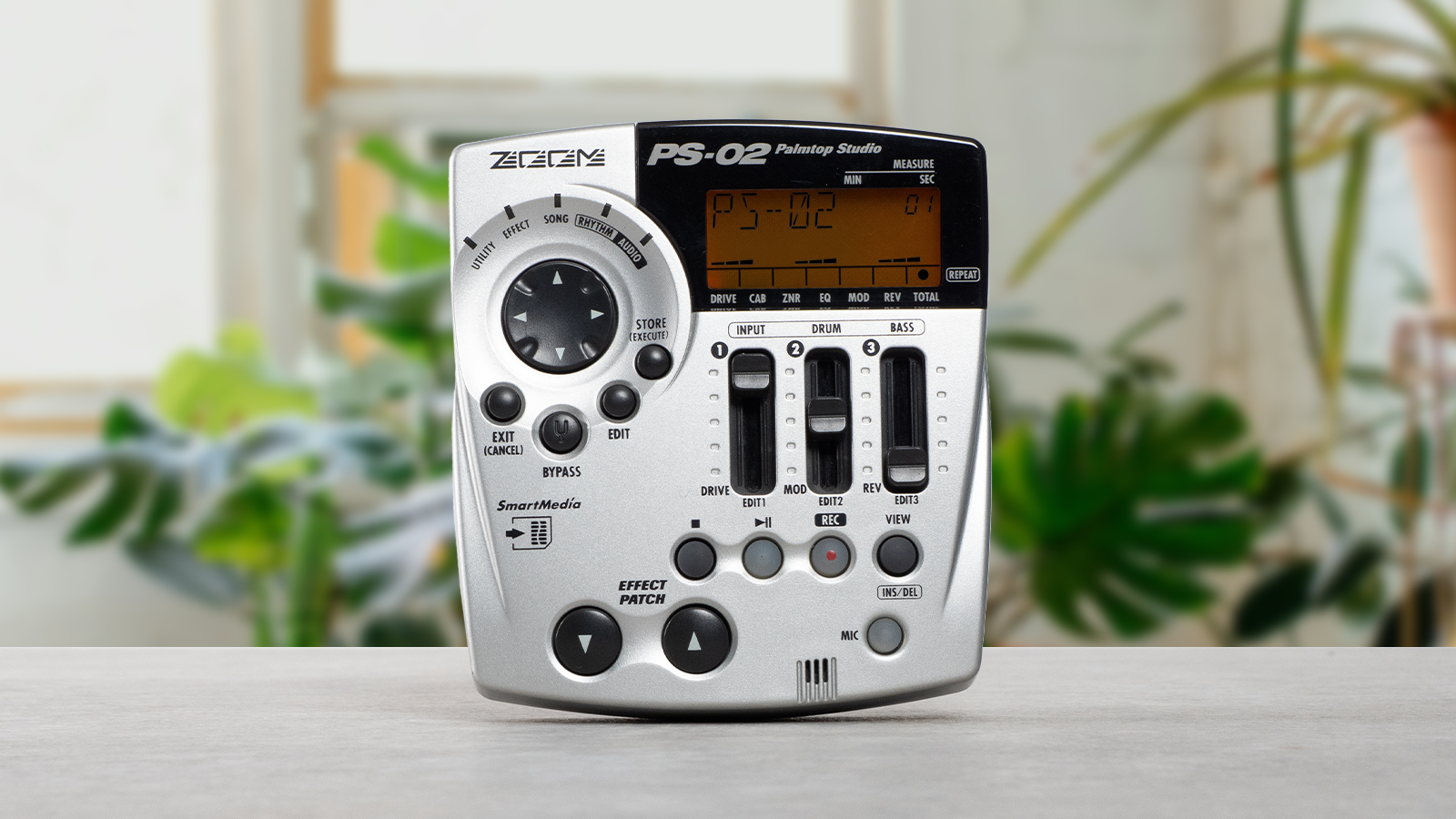 A ZOOM portable MTR PS-02 placed on the desk in the living room with houseplants