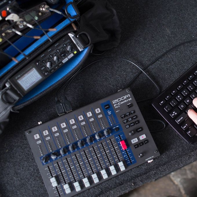 Location sound engineer using a keyboard to input track metadata.