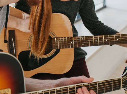 Guitar teacher and student