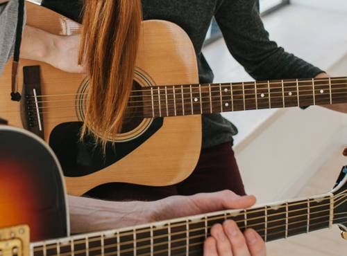 Guitar teacher and student