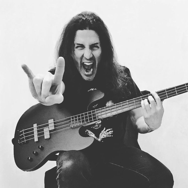 Frank Bello posing with his bass